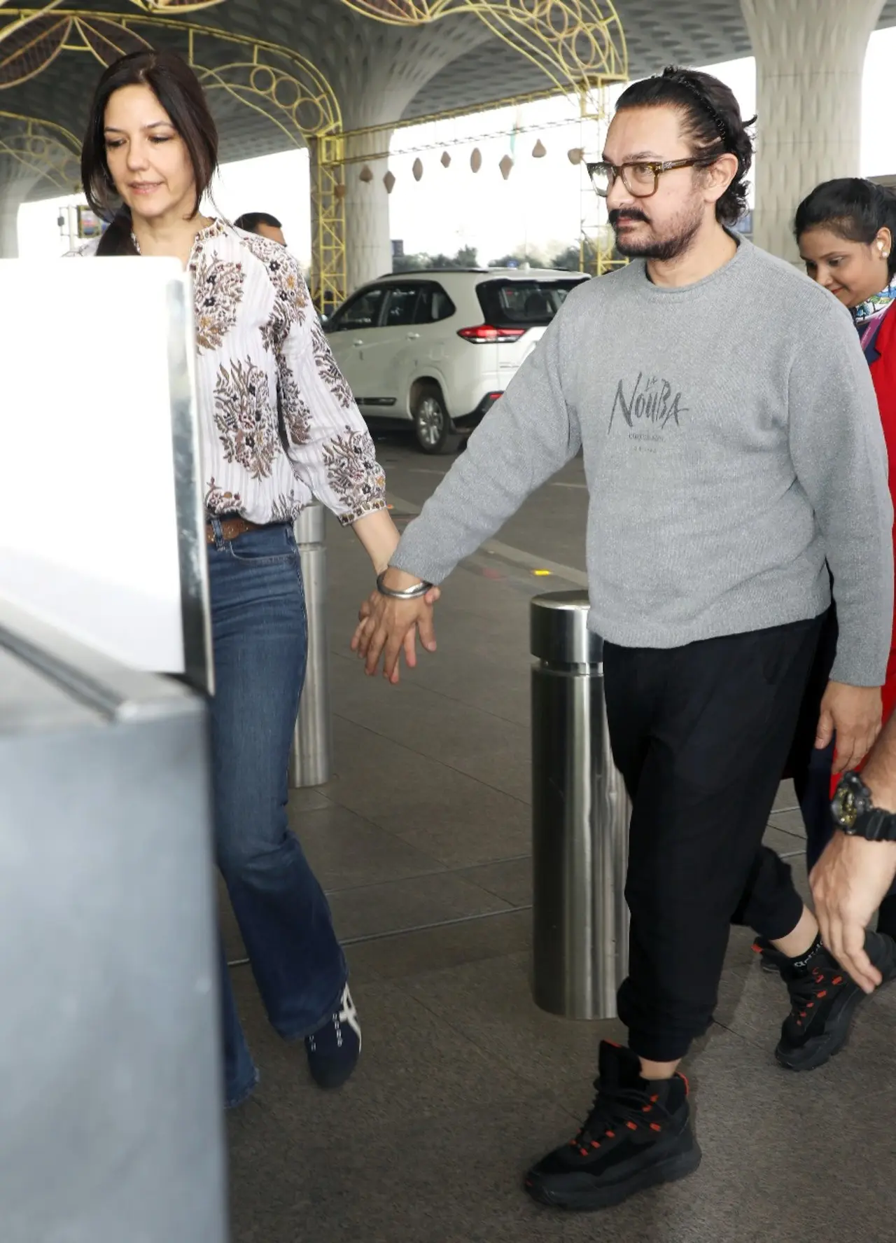 The love birds were seen walking hand-in-hand, proceeding towards the entry gate as they flew out of the city.